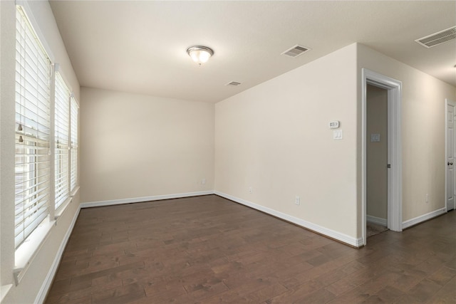 1511 Peyton Oaks Pl, Houston, TX 77043 - empty room featuring dark wood-style flooring and baseboards