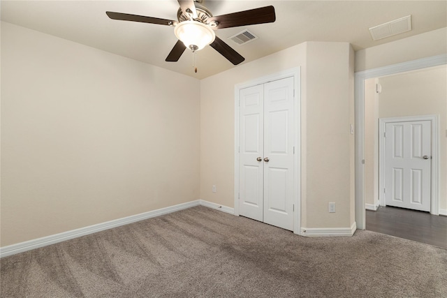 1511 Peyton Oaks Pl, Houston, TX 77043 - unfurnished bedroom with carpet floors, baseboards, a closet, and a ceiling fan