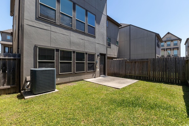 1511 Peyton Oaks Pl, Houston, TX 77043 - back of house featuring central AC, a patio, and stucco siding