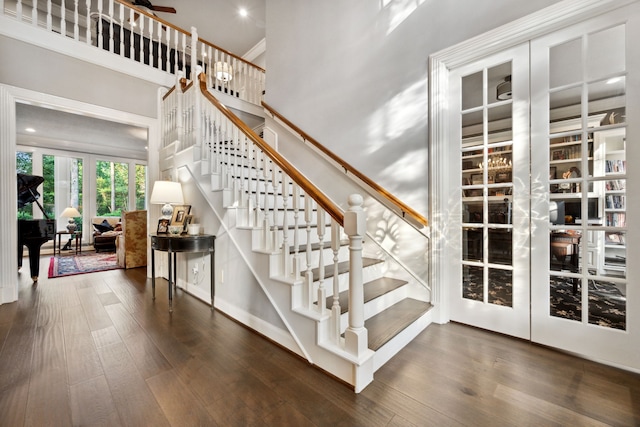 1714 Chestnut Grove Ln, Houston, TX 77345 - stairs with wood finished floors and recessed lighting
