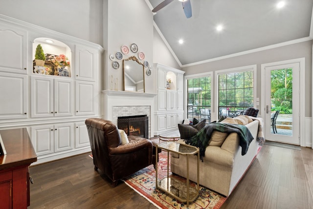 1714 Chestnut Grove Ln, Houston, TX 77345 - living area featuring crown molding, a lit fireplace, high vaulted ceiling, dark wood-style floors, and a ceiling fan
