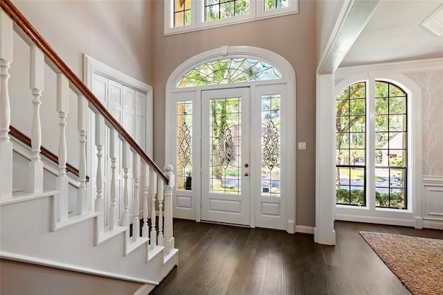 1714 Chestnut Grove Ln, Houston, TX 77345 - entrance foyer with dark wood-style flooring, stairs, and a towering ceiling