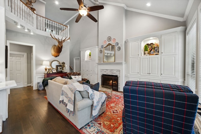 1714 Chestnut Grove Ln, Houston, TX 77345 - living area with ceiling fan, a fireplace, high vaulted ceiling, dark wood-style flooring, and crown molding