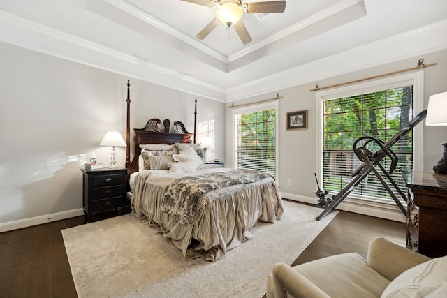 1714 Chestnut Grove Ln, Houston, TX 77345 - bedroom featuring a raised ceiling, ornamental molding, wood finished floors, baseboards, and a ceiling fan