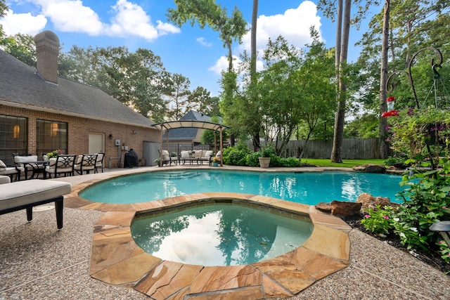 1714 Chestnut Grove Ln, Houston, TX 77345 - view of pool featuring an in-ground hot tub, a fenced backyard, and outdoor dining space