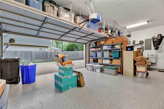 1714 Chestnut Grove Ln, Houston, TX 77345 - garage featuring a garage door opener