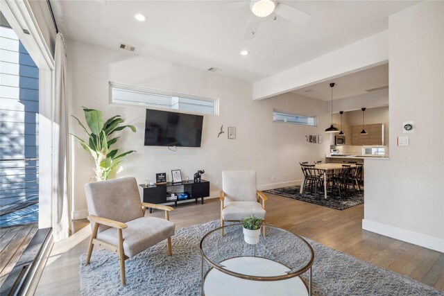 2809 St Emanuel St, Houston, TX 77004 - living room with a ceiling fan, baseboards, wood finished floors, recessed lighting, and plenty of natural light