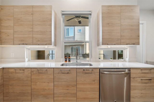 2809 St Emanuel St, Houston, TX 77004 - kitchen with stainless steel dishwasher, a sink, modern cabinets, a ceiling fan, and light countertops