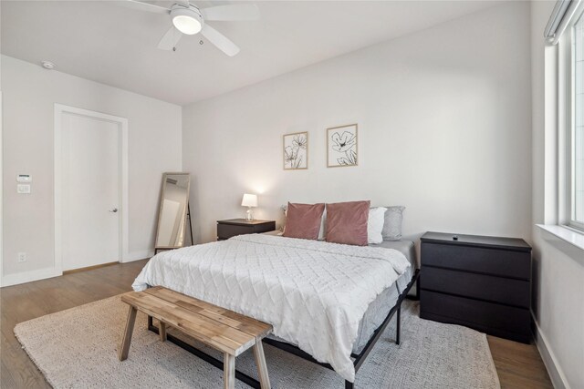 2809 St Emanuel St, Houston, TX 77004 - bedroom with wood finished floors, baseboards, and a ceiling fan