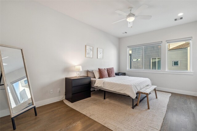 2809 St Emanuel St, Houston, TX 77004 - bedroom featuring dark wood-style flooring, baseboards, and a ceiling fan