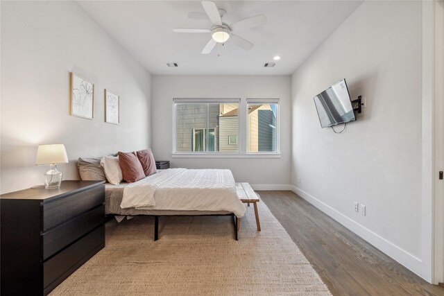 2809 St Emanuel St, Houston, TX 77004 - bedroom with wood finished floors, baseboards, ceiling fan, and recessed lighting