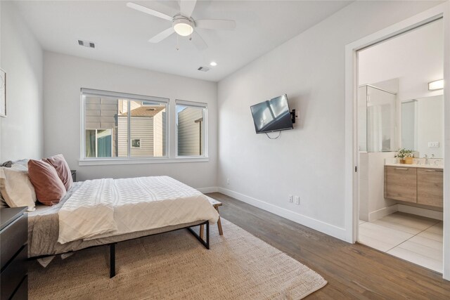 2809 St Emanuel St, Houston, TX 77004 - bedroom with wood finished floors, baseboards, ensuite bathroom, a ceiling fan, and recessed lighting