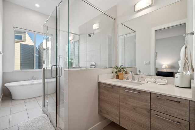2809 St Emanuel St, Houston, TX 77004 - bathroom featuring vanity, a freestanding bath, a stall shower, and tile patterned floors