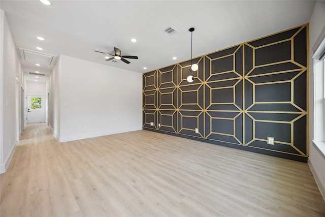 4825 Pederson St A/B, Unit A/B Houston, TX 77033 - spare room with attic access, wood finished floors, ceiling fan, baseboards, and recessed lighting