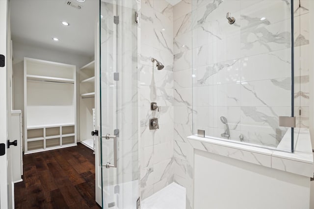 183 Timber Mill St, The Woodlands, TX 77380 - full bathroom with a spacious closet, a marble finish shower, wood finished floors, and recessed lighting