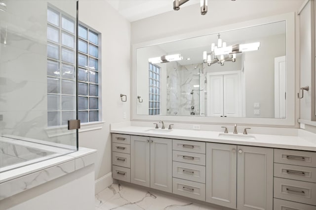 183 Timber Mill St, The Woodlands, TX 77380 - bathroom featuring marble finish floors, a marble finish shower, double vanity, a chandelier, and baseboards