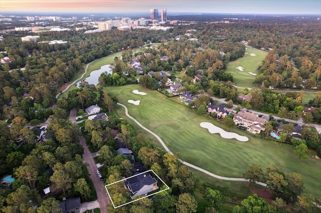 183 Timber Mill St, The Woodlands, TX 77380 - aerial overview of property's location with a local golf course, property boundaries highlighted, and a large body of water