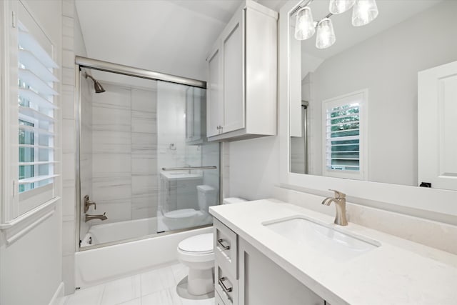 183 Timber Mill St, The Woodlands, TX 77380 - full bathroom featuring toilet, vanity, bath / shower combo with glass door, and marble look tiles