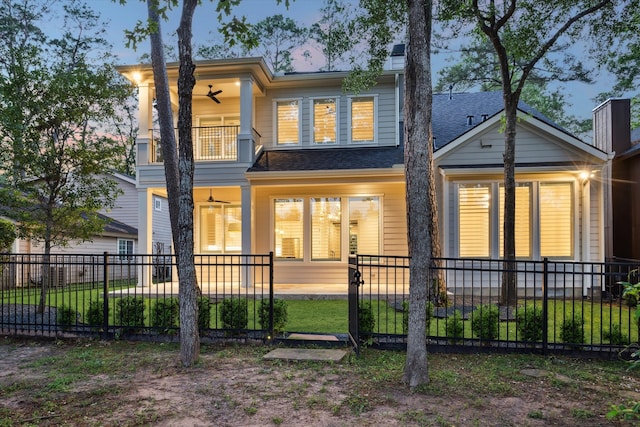 183 Timber Mill St, The Woodlands, TX 77380 - view of front of home featuring a balcony, a fenced front yard, a ceiling fan, a chimney, and a shingled roof