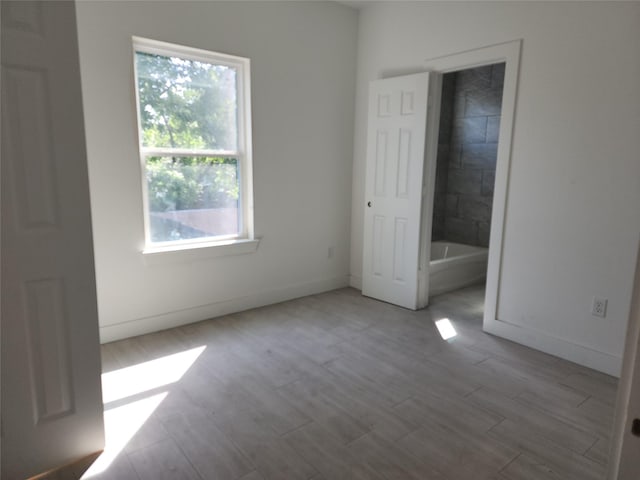 8208/8210 Knox St, Houston, TX 77088 - unfurnished bedroom featuring wood finished floors and baseboards