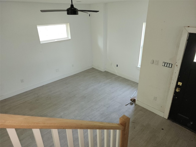 8208/8210 Knox St, Houston, TX 77088 - empty room featuring a ceiling fan, wood finished floors, and baseboards
