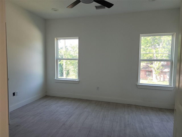 8208/8210 Knox St, Houston, TX 77088 - unfurnished room with ceiling fan, light wood-style floors, and baseboards