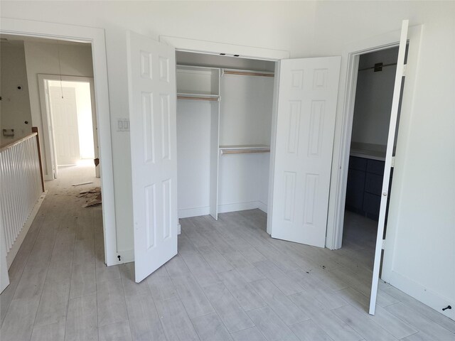 8208/8210 Knox St, Houston, TX 77088 - unfurnished bedroom featuring a closet and light wood-type flooring
