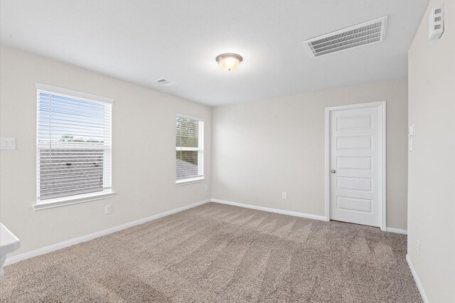 7051 Silverleaf Oak St, Conroe, TX 77304 - unfurnished room featuring carpet and baseboards