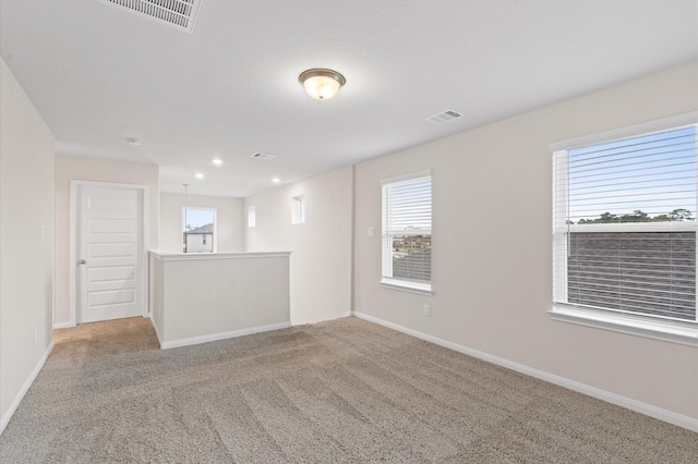 7051 Silverleaf Oak St, Conroe, TX 77304 - spare room featuring carpet and baseboards