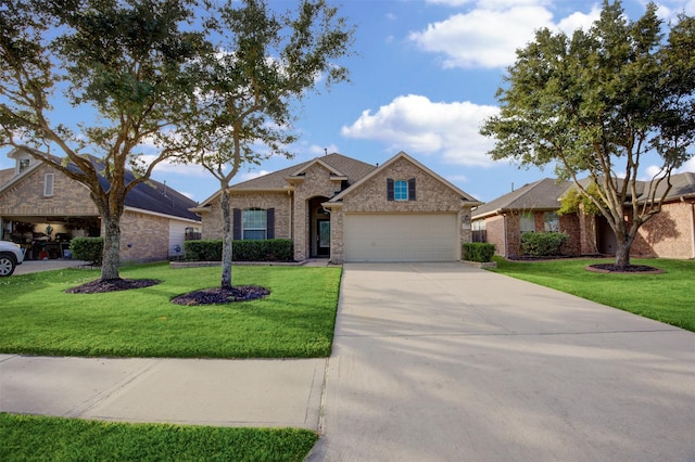 15115 Olmstead Park Dr, Cypress, TX 77429 - traditional-style house featuring a garage, driveway, a front yard, and brick siding