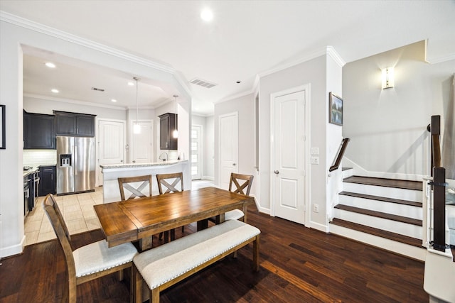 3715 Oakroc Grv, Houston, TX 77018 - dining room featuring recessed lighting, wood-type flooring, stairway, crown molding, and baseboards