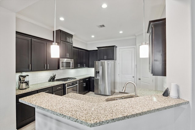 3715 Oakroc Grv, Houston, TX 77018 - kitchen with stainless steel appliances, a sink, light stone counters, crown molding, and backsplash