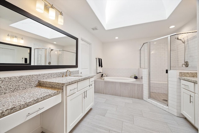 3715 Oakroc Grv, Houston, TX 77018 - full bath featuring vanity, a shower stall, a bath, recessed lighting, and a skylight