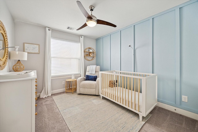 3715 Oakroc Grv, Houston, TX 77018 - carpeted bedroom featuring a nursery area, baseboards, and ceiling fan