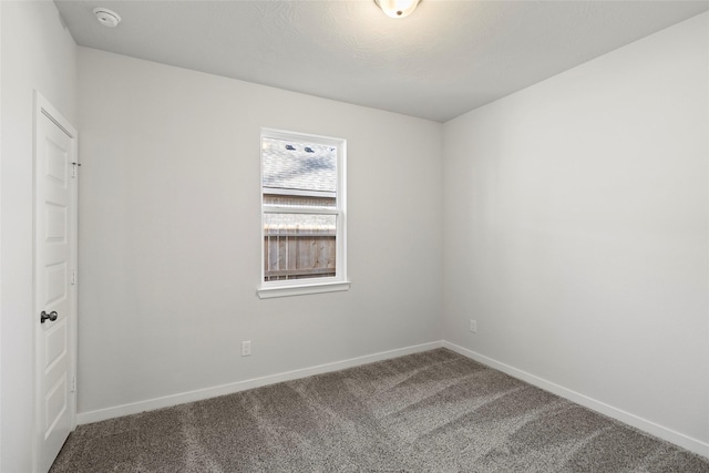 1505 Mirador Dr, Conroe, TX 77301 - spare room featuring a smoke detector, carpet floors, and baseboards