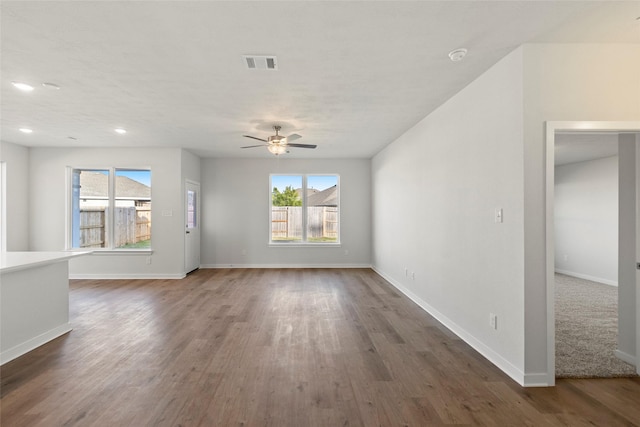 1505 Mirador Dr, Conroe, TX 77301 - unfurnished living room with ceiling fan, dark wood finished floors, baseboards, and recessed lighting