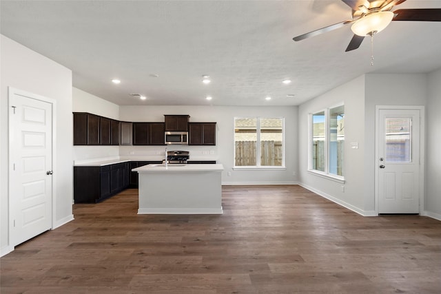 1505 Mirador Dr, Conroe, TX 77301 - kitchen with appliances with stainless steel finishes, a sink, recessed lighting, dark wood finished floors, and baseboards