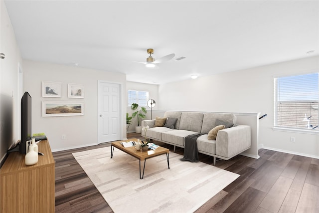 17810 Planted Orchard Dr, Hockley, TX 77447 - living area with dark wood finished floors, ceiling fan, and baseboards