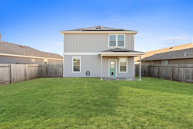 17810 Planted Orchard Dr, Hockley, TX 77447 - rear view of property with solar panels, a patio area, and board and batten siding