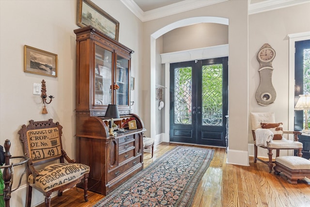 414 E 28th St, Houston, TX 77008 - entryway featuring arched walkways, french doors, hardwood / wood-style flooring, crown molding, and baseboards