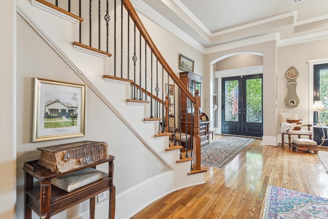 414 E 28th St, Houston, TX 77008 - entryway featuring arched walkways, french doors, wood finished floors, stairway, and ornamental molding