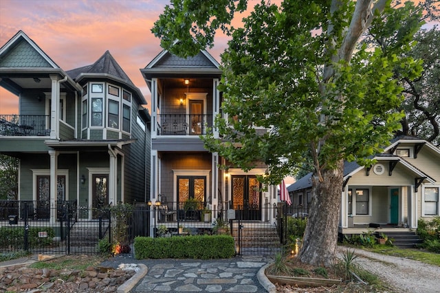 414 E 28th St, Houston, TX 77008 - view of front of property featuring a balcony, covered porch, and french doors
