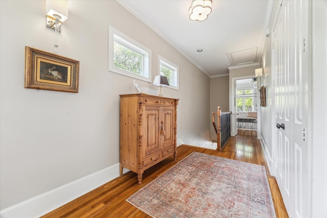 414 E 28th St, Houston, TX 77008 - hallway featuring an upstairs landing, ornamental molding, plenty of natural light, wood finished floors, and baseboards