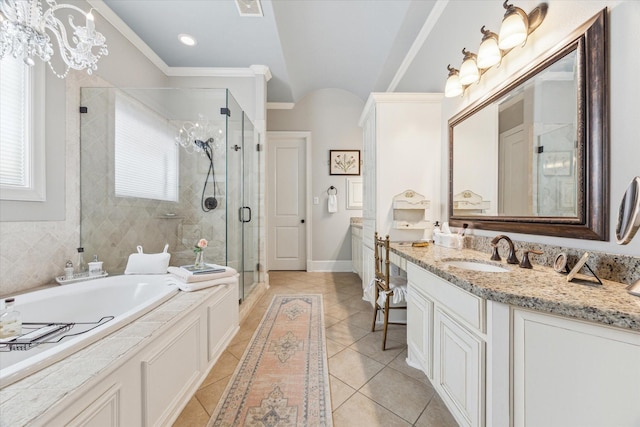 414 E 28th St, Houston, TX 77008 - bathroom featuring tile patterned floors, vanity, a bath, a stall shower, and baseboards