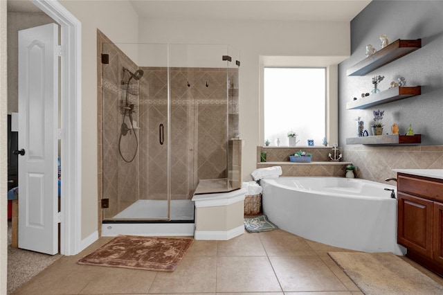 22734 Newcourt Place St, Tomball, TX 77375 - bathroom featuring a garden tub, tile patterned floors, vanity, and a stall shower
