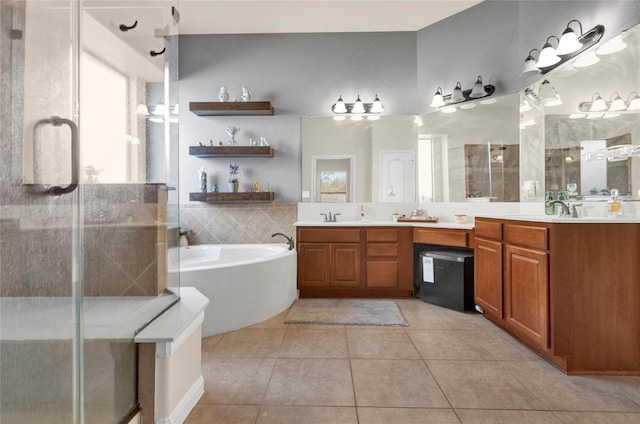 22734 Newcourt Place St, Tomball, TX 77375 - full bathroom with a shower stall, a garden tub, tile patterned floors, and double vanity