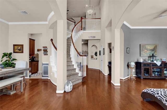 22734 Newcourt Place St, Tomball, TX 77375 - entryway featuring arched walkways, wood finished floors, baseboards, stairway, and crown molding