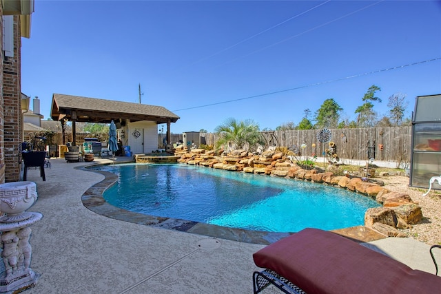 22734 Newcourt Place St, Tomball, TX 77375 - view of pool featuring a fenced backyard, a patio area, a pool with connected hot tub, and an outdoor structure