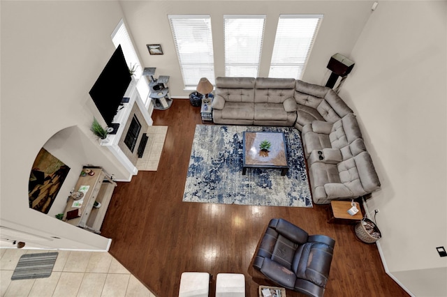22734 Newcourt Place St, Tomball, TX 77375 - living area with wood finished floors and a tiled fireplace