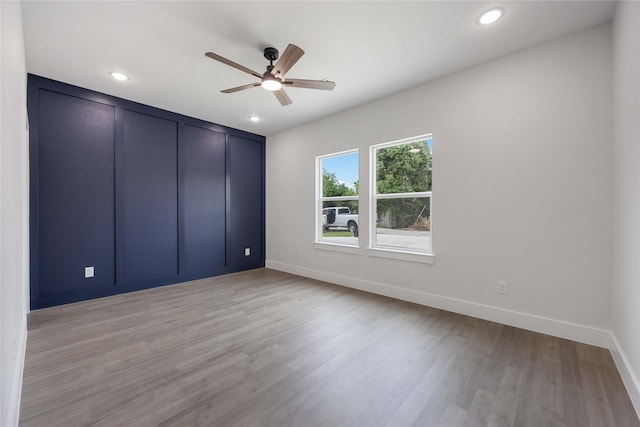 8221 Tower St, Houston, TX 77088 - unfurnished bedroom featuring baseboards, light wood-style floors, recessed lighting, and a ceiling fan